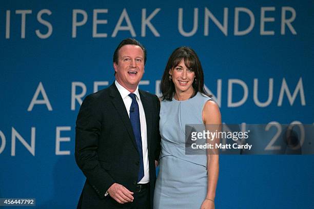 Prime Minister David Cameron stands with his wife Samantha after giving his keynote speech to the Conservative party conference on October 1, 2014 in...