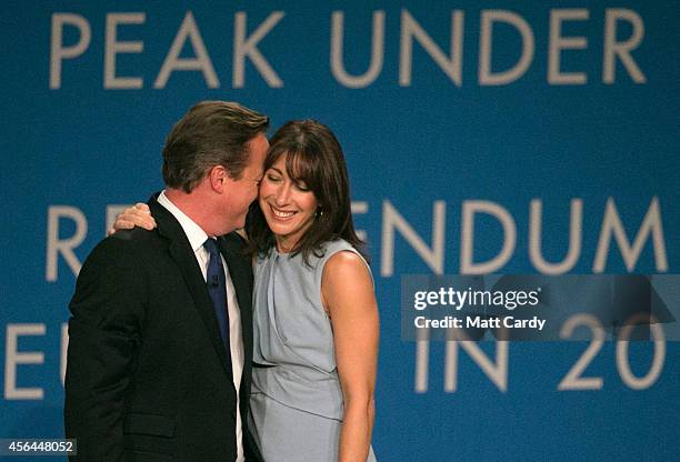 Prime Minister David Cameron stands with his wife Samantha after giving his keynote speech to the Conservative party conference on October 1, 2014 in...