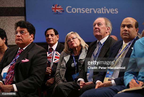 Delegates applaud as Prime Minister David Cameron delivers his keynote speech to the Conservative party conference on October 1, 2014 in Birmingham,...