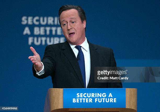 Prime Minister David Cameron gestures as he delivers his keynote speech to the Conservative party conference on October 1, 2014 in Birmingham,...