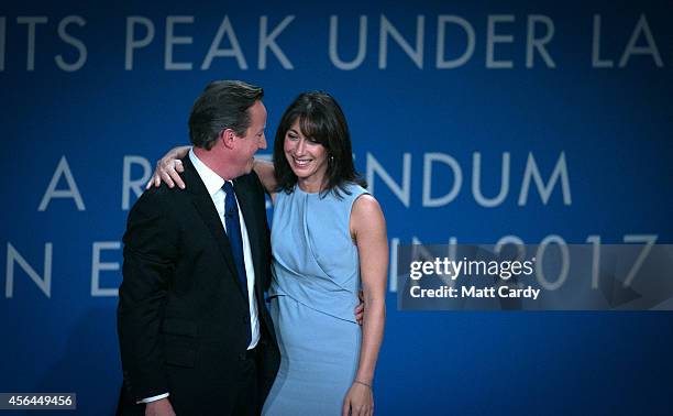 Prime Minister David Cameron stands with his wife Samantha after giving his keynote speech to the Conservative party conference on October 1, 2014 in...