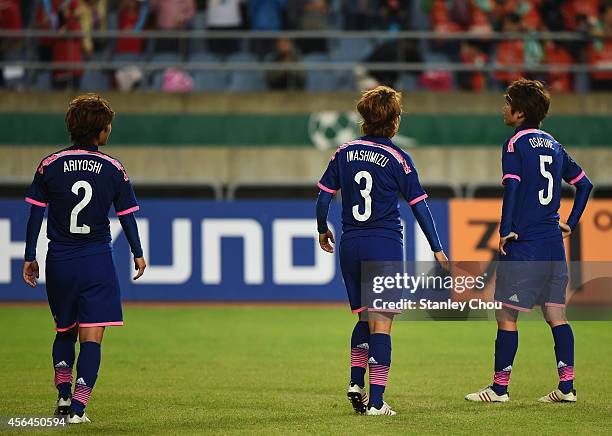 Saori Ariyoshi, Azusa Iwashimizu and Kana Osafune of Japan react after 1-3 defeat by North Korea in the Football Women's Gold Medal match between...