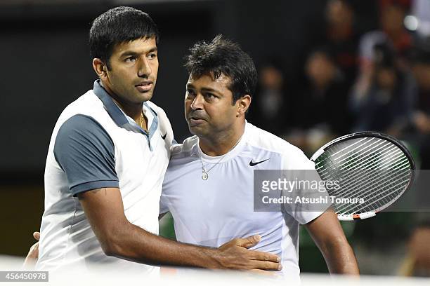 Rohan Bopanna and Leander Paes of India celebrate after winning men's doubles first round match against Tatsuma Ito and Go Soeda of Japan on day...
