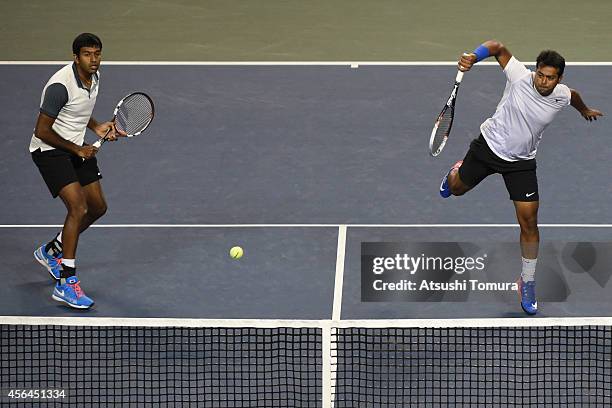 Rohan Bopanna and Leander Paes of India in action during men's doubles first round match against Tatsuma Ito and Go Soeda of Japan on day three of...