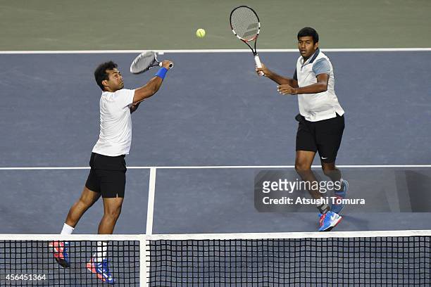 Rohan Bopanna and Leander Paes of India in action during men's doubles first round match against Tatsuma Ito and Go Soeda of Japan on day three of...
