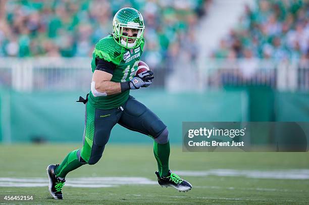 Brett Swain of the Saskatchewan Roughriders runs with the ball after a catch in a game between the Ottawa Redblacks and Saskatchewan Roughriders in...