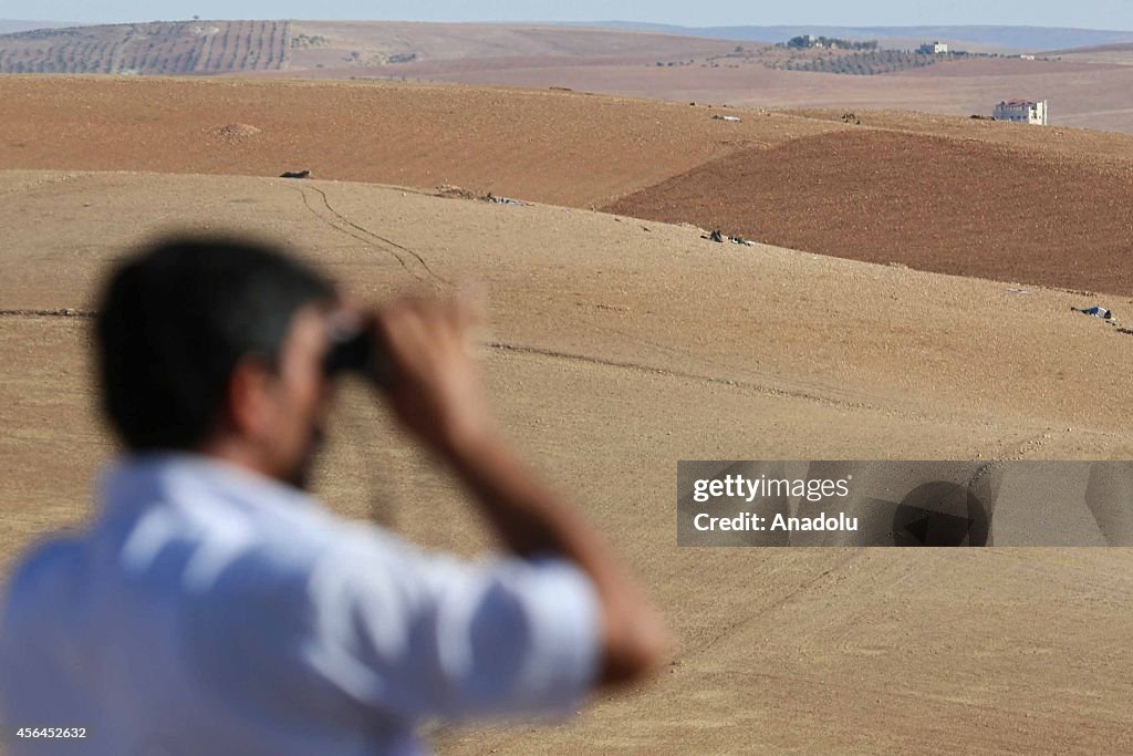 ISIL militants fight against the Kurdish armed groups