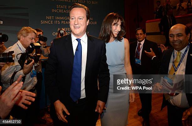 Prime Minister David Cameron and his wife Samantha leave the stage following his keynote speech to the Conservative party conference on October 1,...