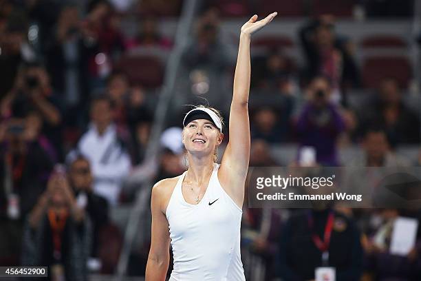Maria Sharapova of Russia celebrates winning against Caria Suarez Navarro of the Spain during day five of the China Open at the China National Tennis...