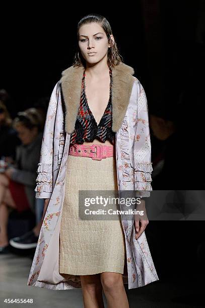 Model walks the runway at the Miu Miu Spring Summer 2015 fashion show during Paris Fashion Week on October 1, 2014 in Paris, France.