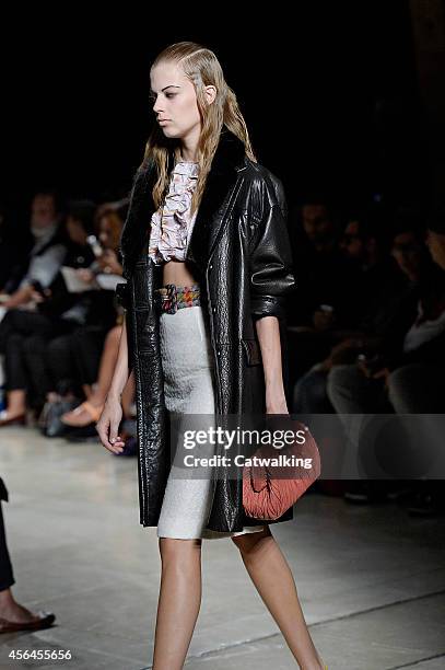 Model walks the runway at the Miu Miu Spring Summer 2015 fashion show during Paris Fashion Week on October 1, 2014 in Paris, France.