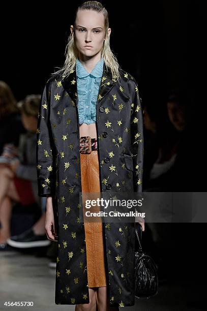 Model walks the runway at the Miu Miu Spring Summer 2015 fashion show during Paris Fashion Week on October 1, 2014 in Paris, France.