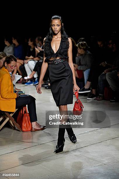 Model walks the runway at the Miu Miu Spring Summer 2015 fashion show during Paris Fashion Week on October 1, 2014 in Paris, France.