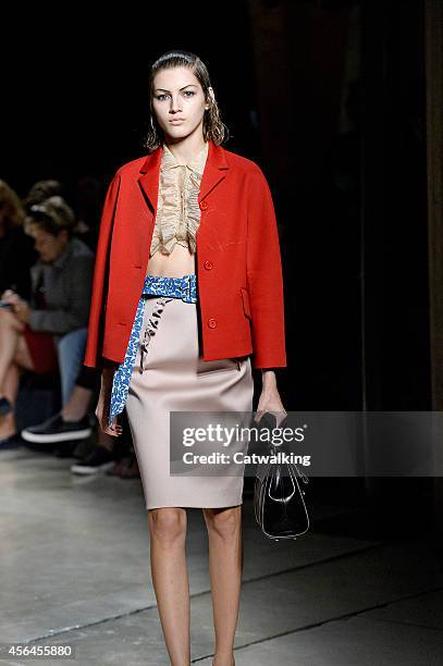 Model walks the runway at the Miu Miu Spring Summer 2015 fashion show during Paris Fashion Week on October 1, 2014 in Paris, France.