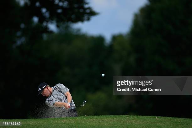 Martin Piller hits a shot from a fairway bunkerduring the second round of the Chiquita Classic held at River Run Country Club on September 5, 2014 in...