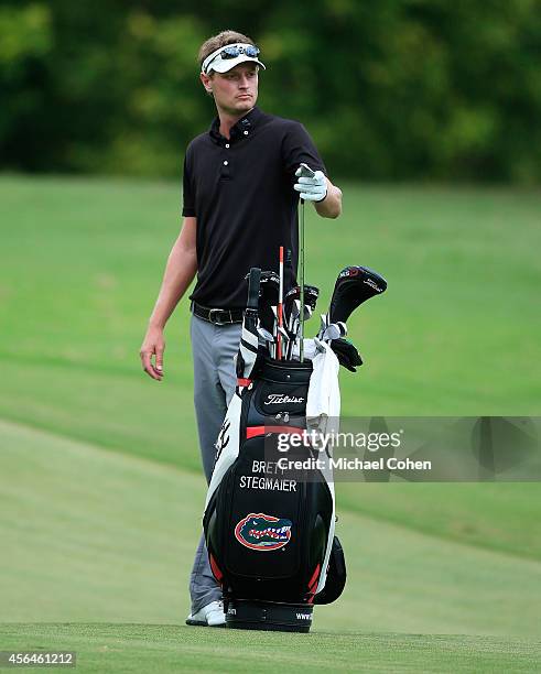 Brett Stegmaier stands by his golf bag as he prepares to hit his second shot on the ninth hole during the second round of the Chiquita Classic held...