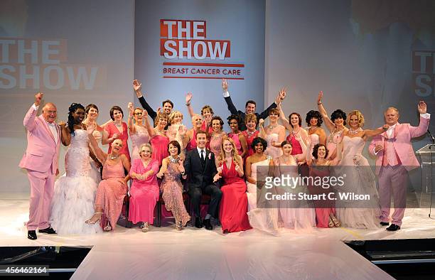 Camilla Kerslake and Ollie Barnes, Stephen Bowman & Humphrey Berney of Vocal Group Blake pose on stage with models who are participating in the...