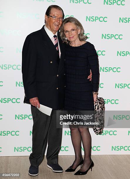Sir Roger Moore and his wife Kristina Tholstrup attend A Night Out With Michael Caine at Royal Albert Hall on October 1, 2014 in London, England.