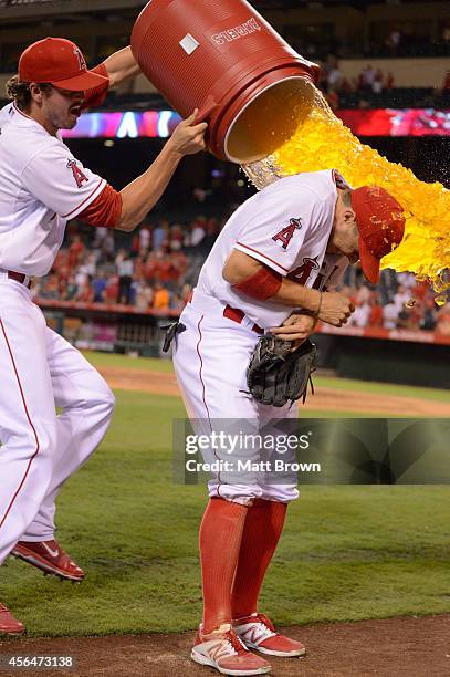 Grant Green of the Los Angeles Angels of Anaheim dumps Gatorade on teammate Tony Campana after the game against the Seattle Mariners on September 15,...