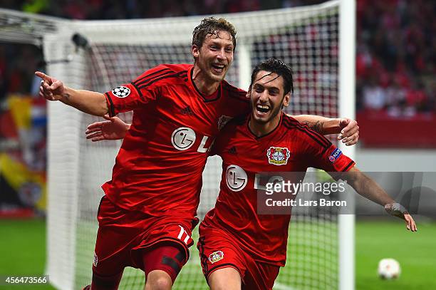 Stephan Kiessling of Bayer Leverkusen celebrates scoring the opening goal with Hakan Calhanoglu of Bayer Leverkusen during the UEFA Champions League...