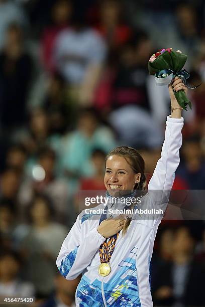 Olga Safronova of Kazakhstan celebrates winning the gold medal in the Women's 200m Final on day twelve of the 2014 Asian Games at Incheon Asiad Main...