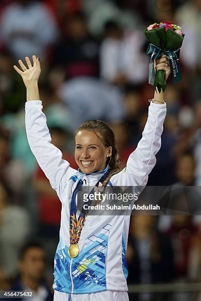 Olga Safronova of Kazakhstan celebrates winning the gold medal in the Women's 200m Final on day twelve of the 2014 Asian Games at Incheon Asiad Main...
