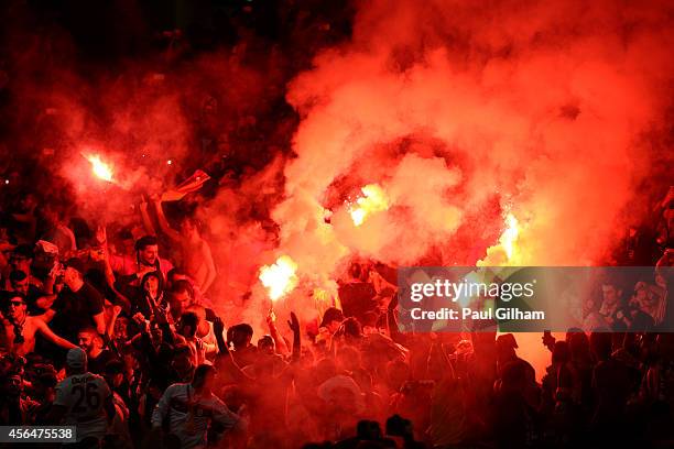 Galatasaray AS light flare after conceding a second goal during the UEFA Champions League group D match between Arsenal FC and Galatasaray AS at...