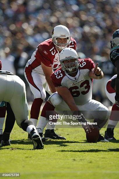 Lyle Sendlein and Kurt Warner of the Arizona Cardinals at the line of scrimmage during a game against the Carolina Panthers on October 26, 2008 at...