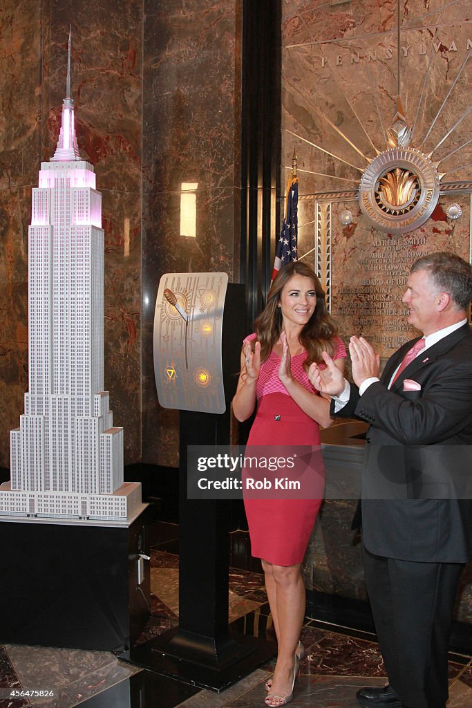 William P. Lauder And Elizabeth Hurley Visit The Empire State Building To Raise Awareness For Breast Cancer