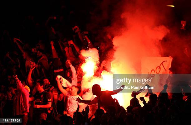 Galatasaray AS light flare after conceding a second goal during the UEFA Champions League group D match between Arsenal FC and Galatasaray AS at...