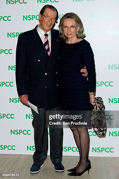 Roger Moore and Kristina Tholstrup attends A Night Out With Michael Caine at Royal Albert Hall on October 1, 2014 in London, England.