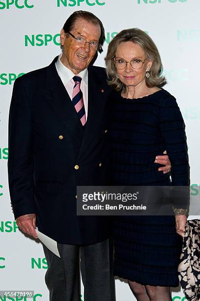 Roger Moore and Kristina Tholstrup attends A Night Out With Michael Caine at Royal Albert Hall on October 1, 2014 in London, England.