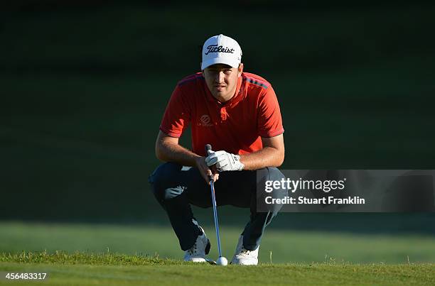 Daniel Brooks of England lines up a putt during the weather delayed second round of the Nelson Mandela Championship at Mount Edgecombe Country Club...