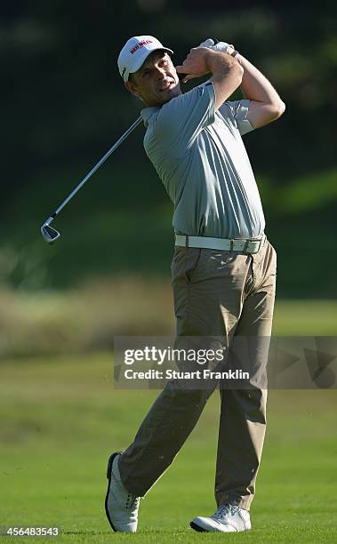 David Higgins of Ireland plays a shot during the weather delayed second round of the Nelson Mandela Championship at Mount Edgecombe Country Club on...