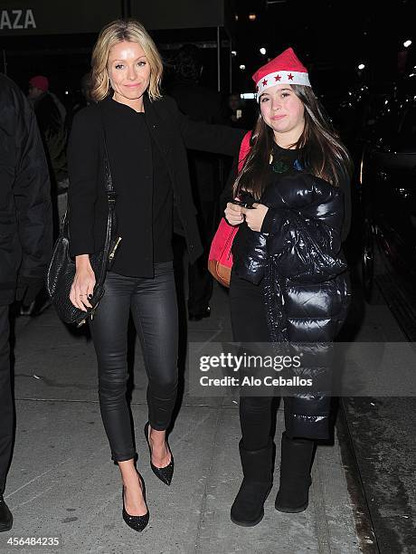 Kelly Ripa and Lola Grace Consuelos are seen on December 13, 2013 in New York City.