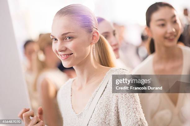 Models prepare backstage prior the Allude show as part of the Paris Fashion Week Womenswear Spring/Summer 2015 on October 1, 2014 in Paris, France.