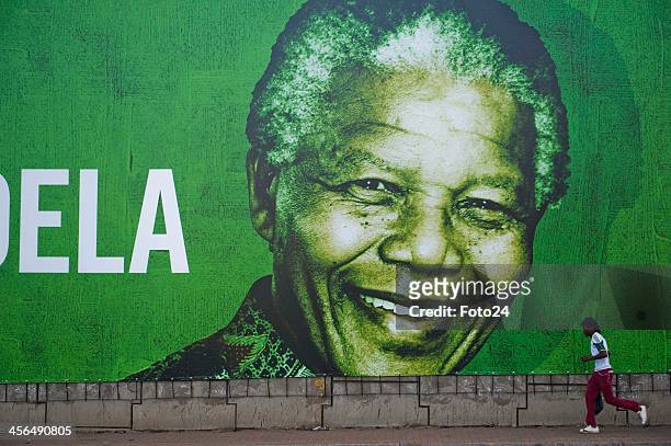 Poster of Nelson Mandela on Potgieter street on December 14, 2013 in Pretoria, South Africa. Former South African president, Nelson Mandela, passed...