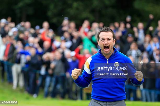 Graeme McDowell of Europe reacts after victory against Jordan Spieth of the United States on the 17th hole during the Singles Matches of the 2014...
