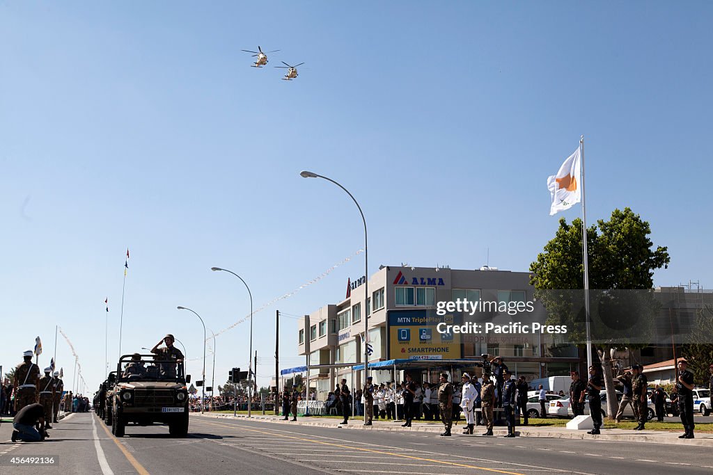 Army cars, helicopters and military forces parading infornt...