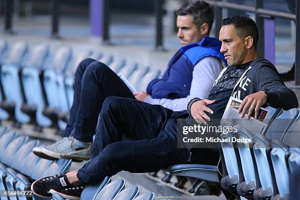 Retired Bulldogs player Daniel Giansiracusa and former Crows champion Andrew McLeod look on during the 2014 AFL Draft Combine at Etihad Stadium on...