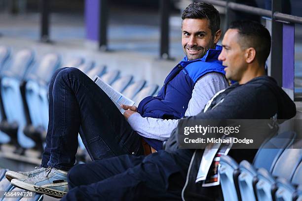 Retired Bulldogs player Daniel Giansiracusa and former Crows champion Andrew McLeod talk during the 2014 AFL Draft Combine at Etihad Stadium on...