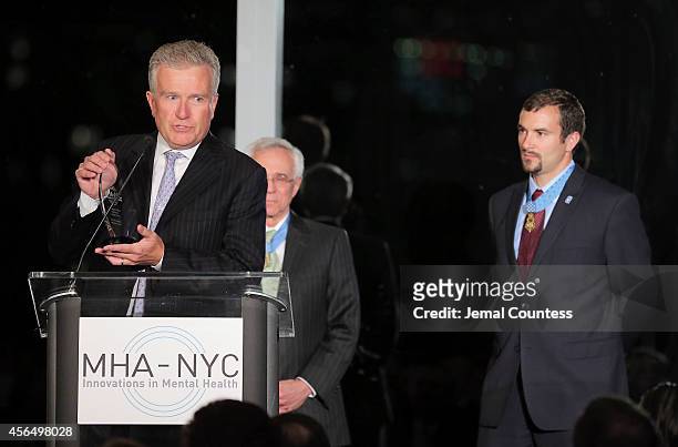 Former CEO of NYSE and Dinner Chair Duncan Niederauer honors Congressional Medal of Honor Recipient and Honoree Sal Giunta during the 2014 "Working...