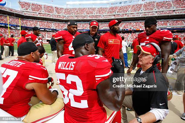 Linebackers Coach Jim Leavitt of the San Francisco 49ers talks with Patrick Willis during the game against the Philadelphia Eagles at Levi Stadium on...