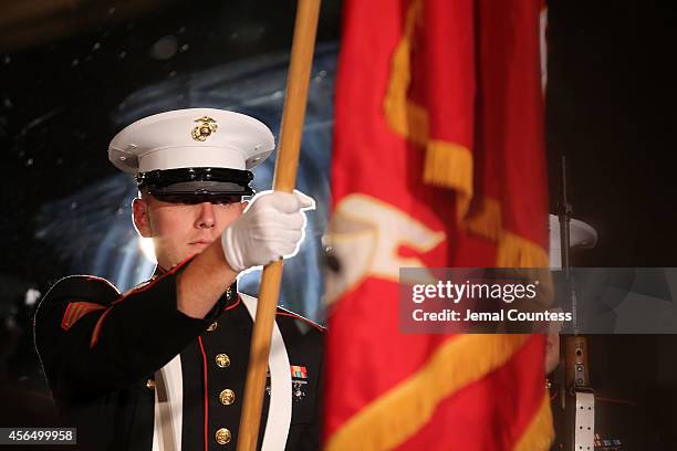 The United States Marine Corps 6th Communication Battalion's Color Guard presents colors during the 2014 "Working for Wellness And Beyond" Gala at...