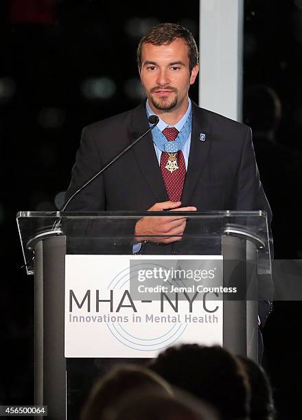 Congressional Medal of Honor Recipient and Honoree Sal Giunta speaks during the 2014 "Working for Wellness And Beyond" Gala at Mandarin Oriental...