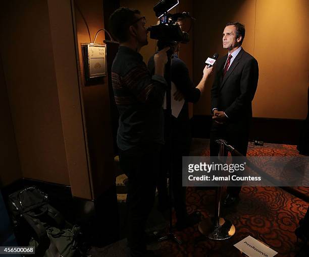 Journalist and Gala host Bob Woodruff speaks to the media during the 2014 "Working for Wellness And Beyond" Gala at Mandarin Oriental Hotel on...