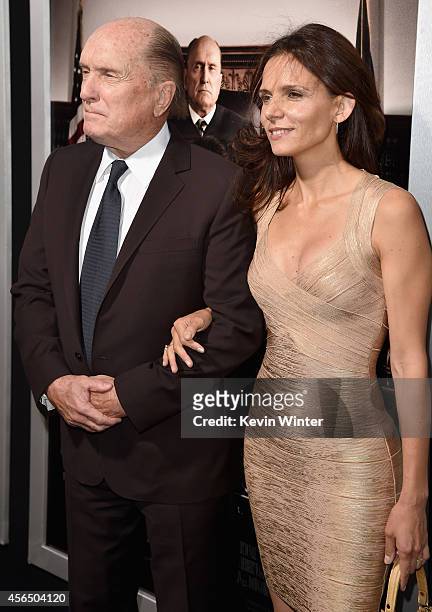 Actor Robert Duvall and Luciana Pedraza attend the Premiere of Warner Bros. Pictures and Village Roadshow Pictures' "The Judge" at AMPAS Samuel...