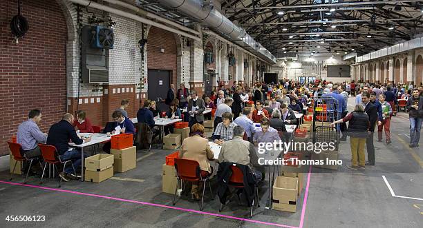 Members of the German Social Democrats count votes from other members on December 14, 2013. Several hundred thousand members of the SPD have voted...