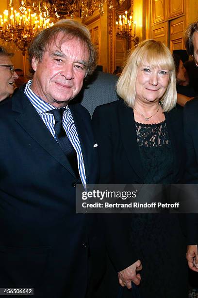 Architect Jean-Michel Wilmotte and his wife attend Xavier Darcos receives 'L'Epee d'Academicien' in Paris on October 1, 2014 in Paris, France.