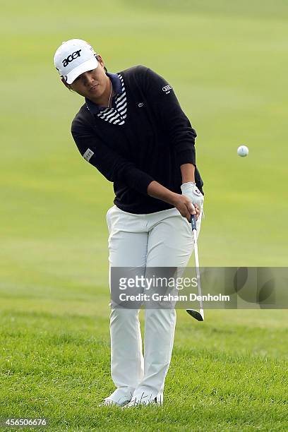 Yani Tseng of Taiwan chips to the green during day one of the 2014 Reignwood LPGA Classic at Reignwood Pine Valley Golf Club on October 2, 2014 in...